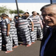 Maricopa County Sheriff Arpaio stands with prisoners. (Google)